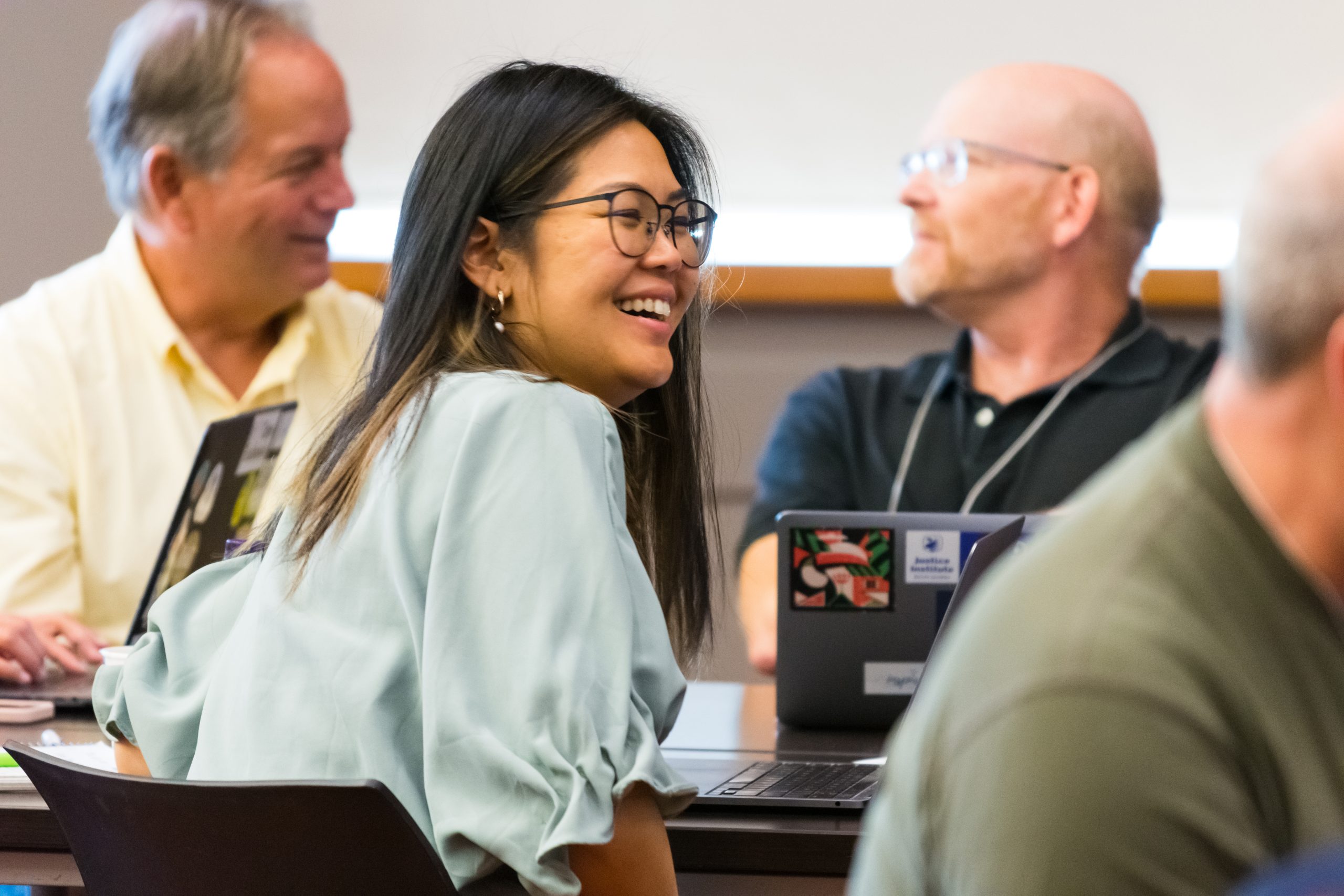 Day 1 of the ETUG conference showing a table of three people attending.