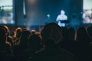 A person holding a conference at time of crisis