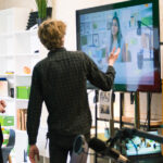 Participants interacting with video simulations during the ctli Studio open house