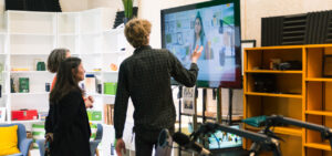 Participants interacting with video simulations during the ctli Studio open house