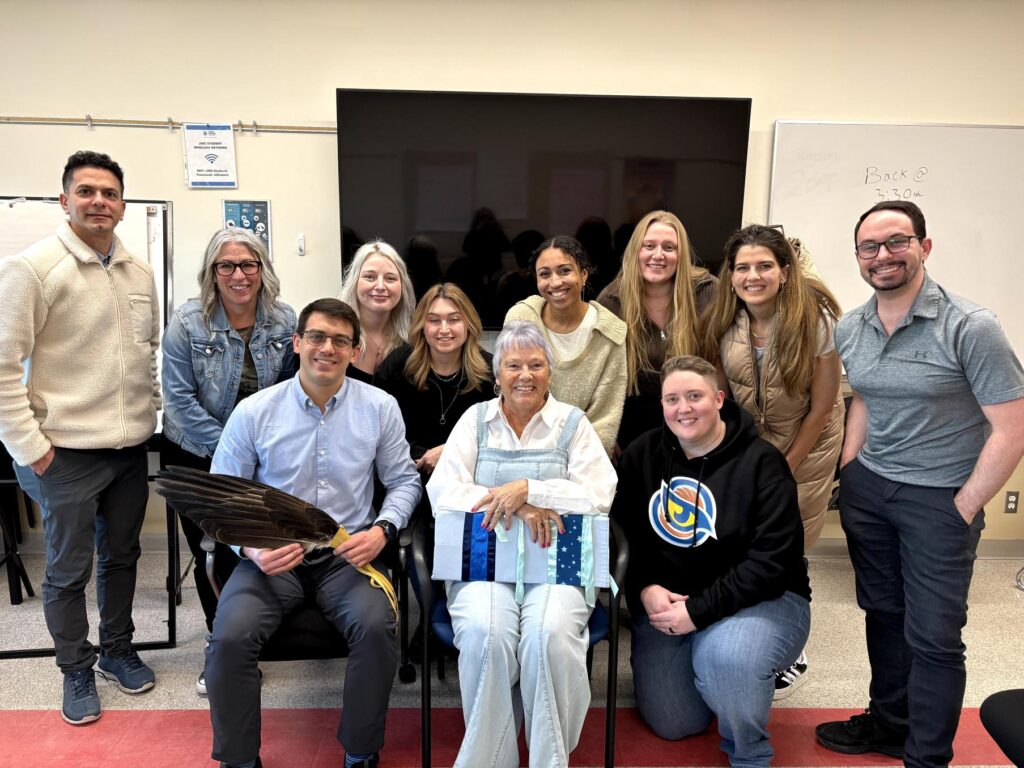 Elder-in-Residence Caroline Buckshot & APO Instructors Eric Bauer & Logan Walden are pictured with the first cohort of Community Corrections staff to experience This is Not a Ceremony in training.