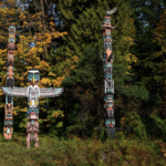 Image of totem poles taken from the Living Indigenization 2021-2017.