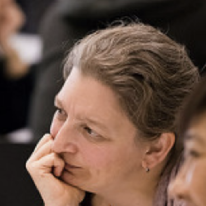 Profile picture of Amy Severson holding her chin in her hand, thinking deeply.