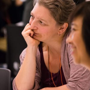 Profile picture of Amy Severson holding her chin in her hand, thinking deeply.